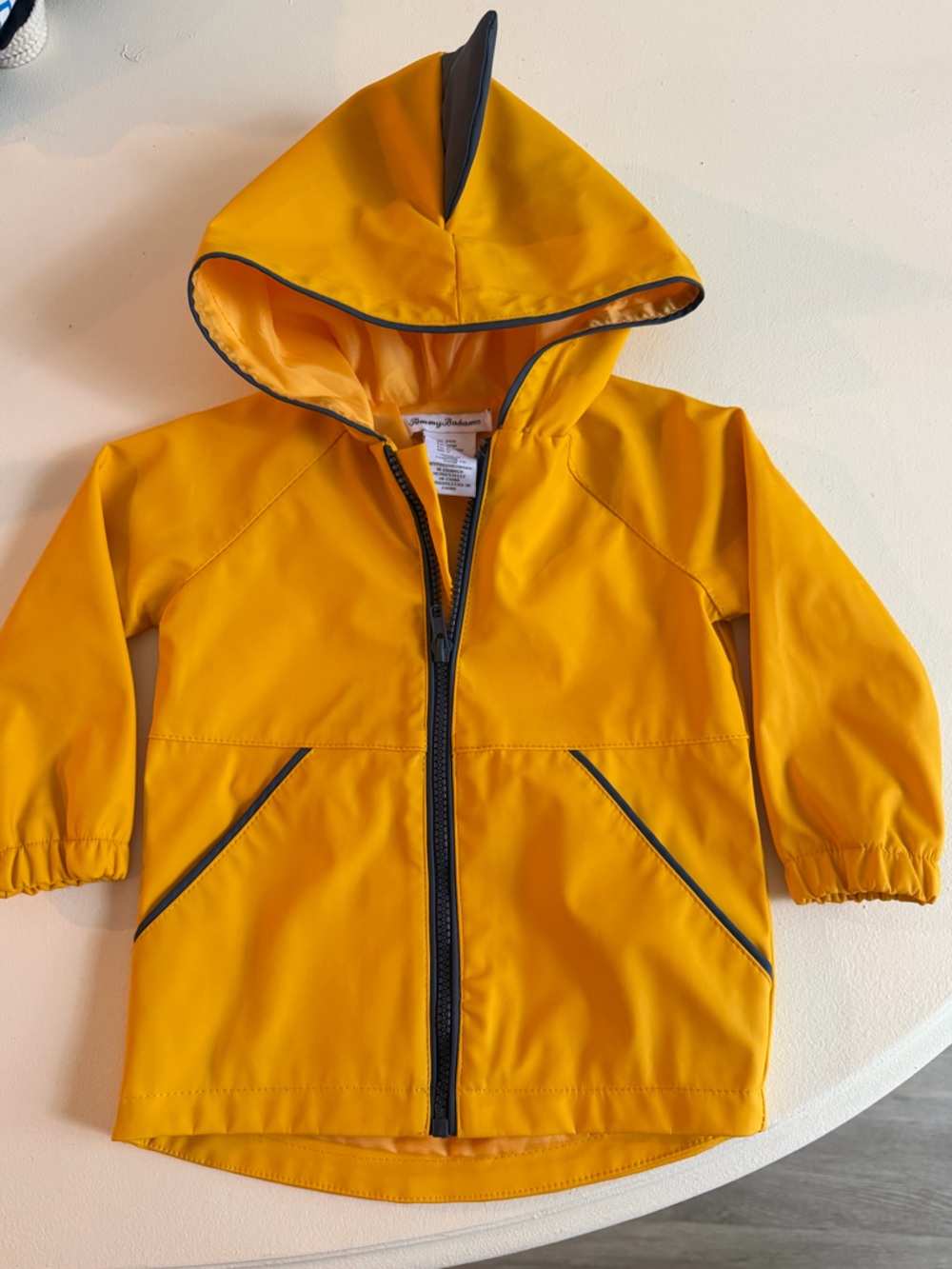 Tommy Bahama Bright Yellow Kids Hooded Raincoat with single shark fin